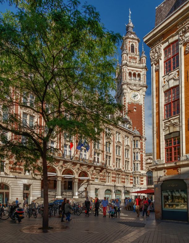 Rue des 3 Couronnes Lille, France - July 1, 2017 : A view on the Béffroi building and the Theatre place during a sunny day